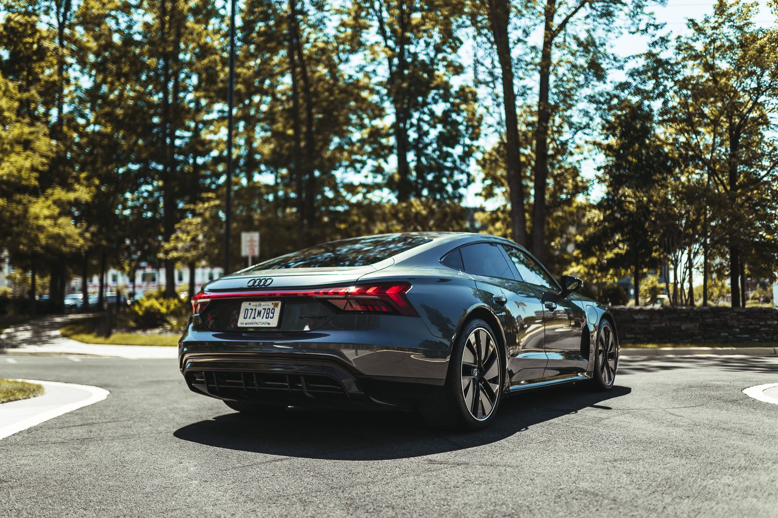 Black Audi parked outdoors on a sunny day