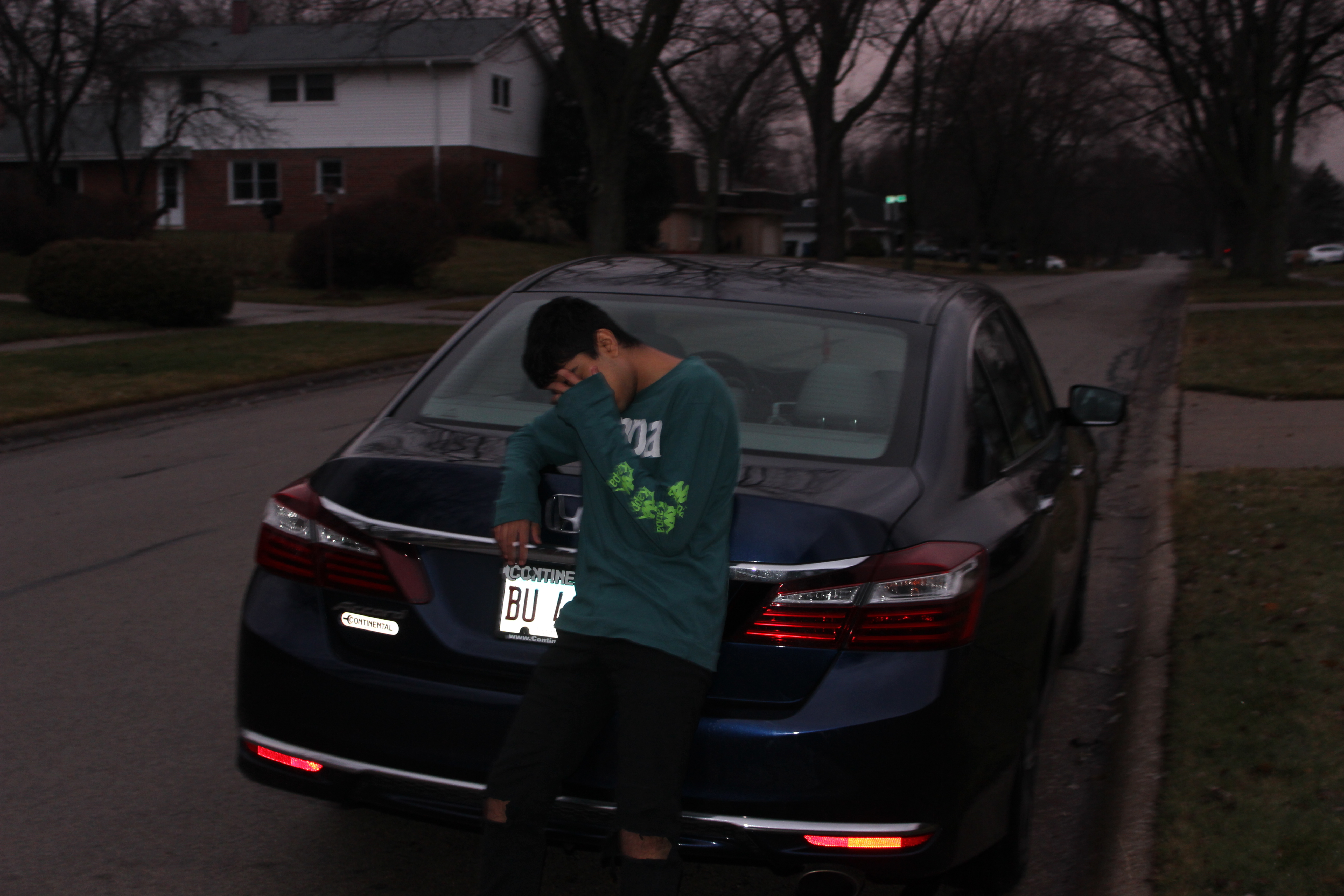 Blue facelifted Honda Accord LX sedan viewed from the rear