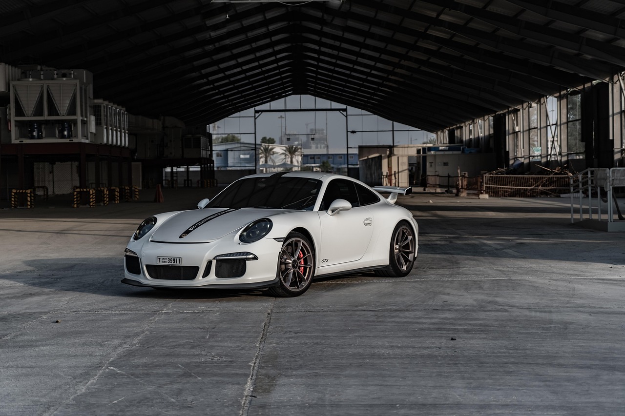 White Porsche 911 GT3 in an industrial building