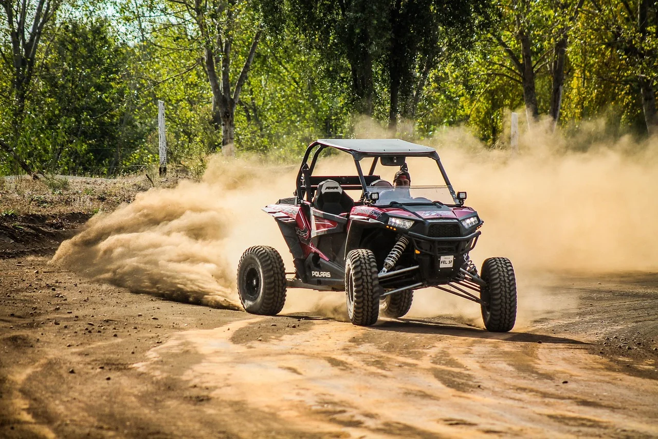 Polaris RZR side-by-side on a dirt trail